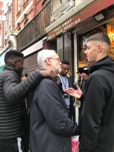 Jeremy Corbyn canvassing, talking to young people, December 2019 
© Julia Bard